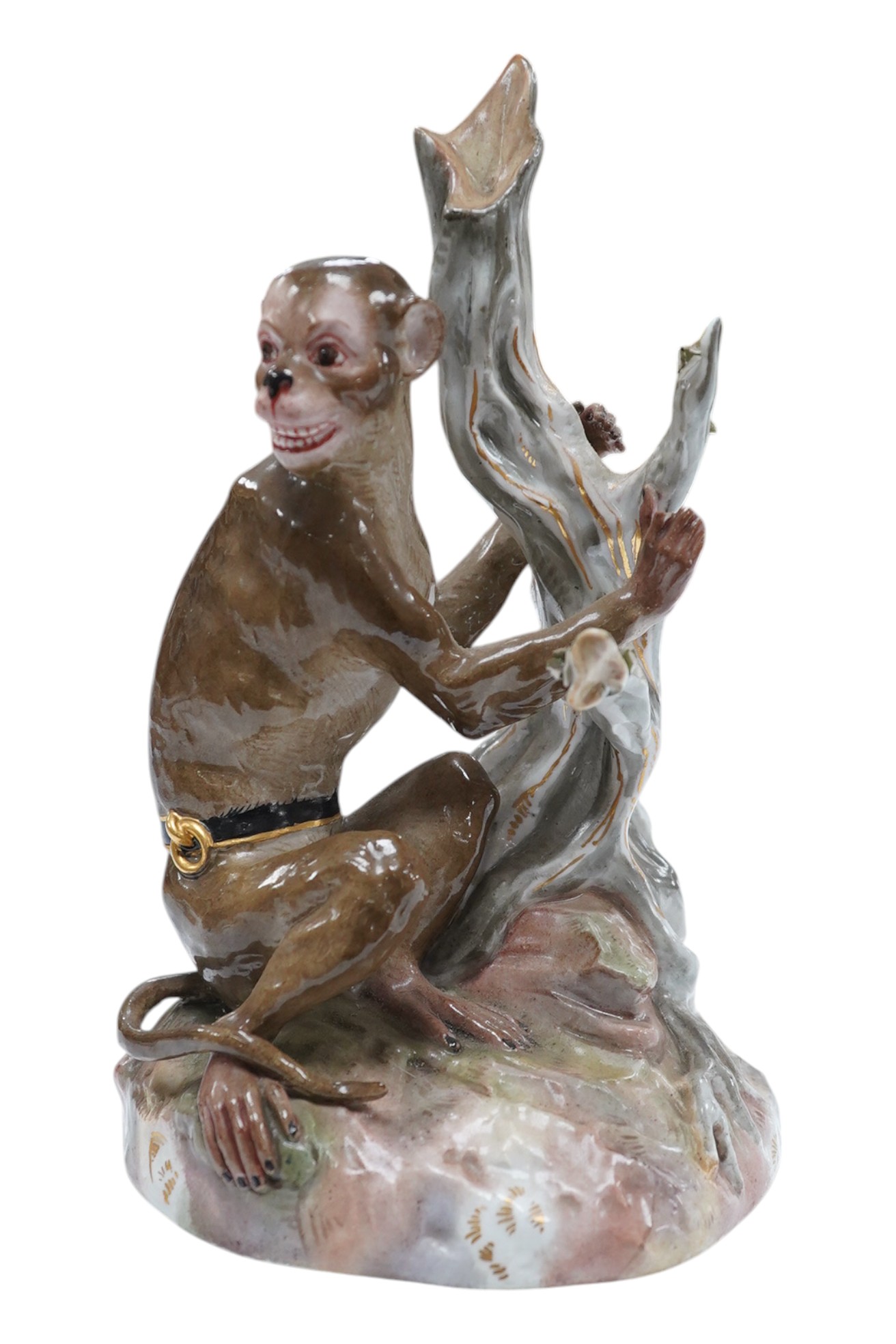 A 19th century Meissen painted porcelain model of a Rhesus Monkey, modelled by Johann Joachim Kaendler, number 1131, 19cm. Condition - damage to fingers and leaves